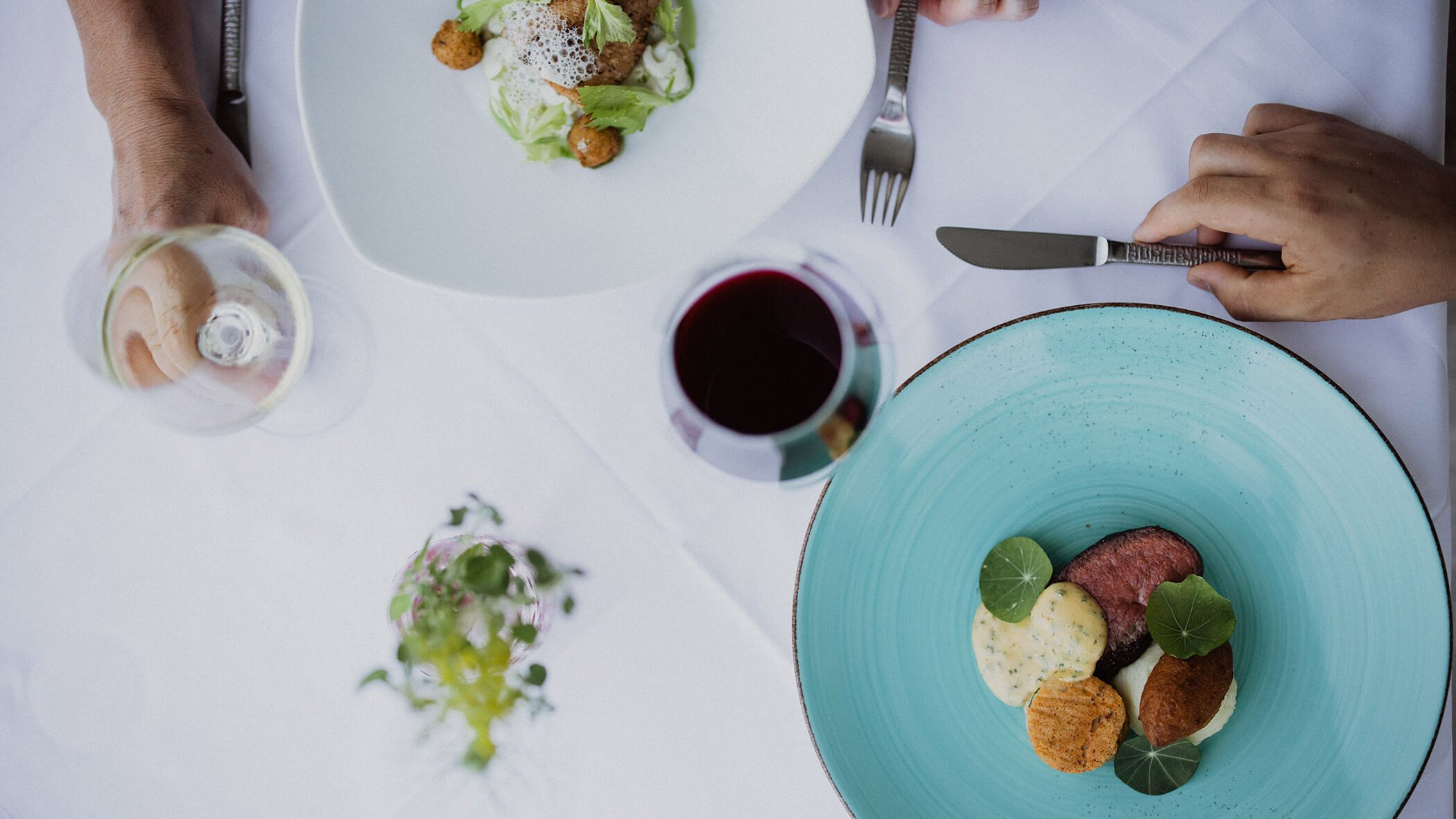 Bird's eye view of a set table with two main courses